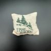 pillow with printed trees and text that reads "I Pine For You"