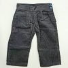 A pair of dark gray corduroy jeans