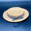 Straw hat with black and white gingham bow