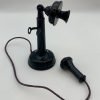 The black candlestick style phone.