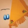 A yellow triangular shawl with fringe going across two of the edges. Also a turquoise pair of flat dress shoes as well as a black choker necklace with a golden teardrop pendant.